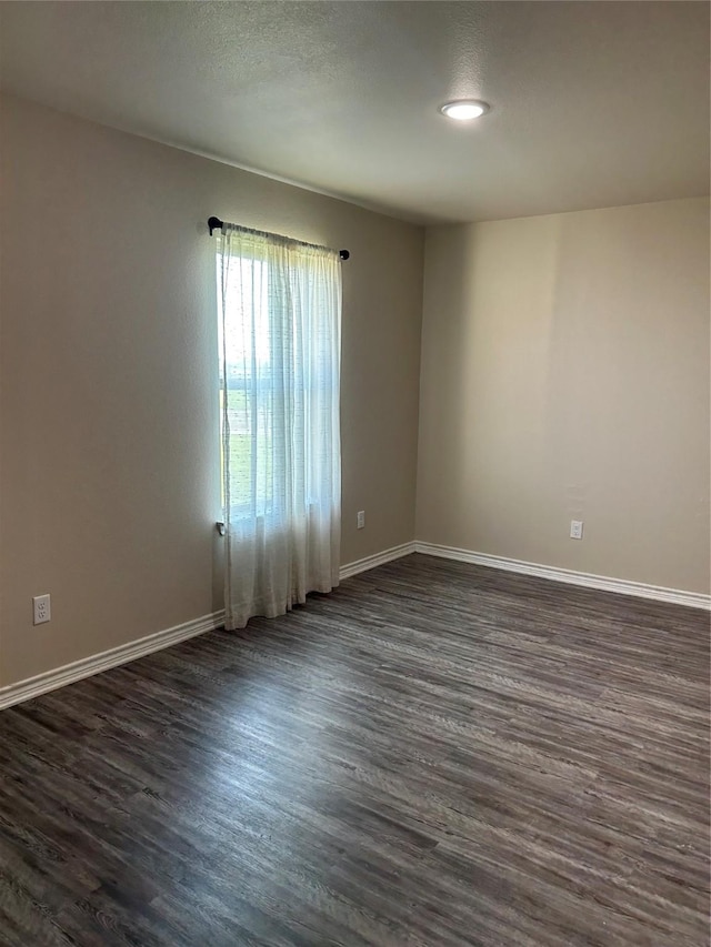18287 County Road 4001, Mabank, TX 75147 - empty room featuring dark wood finished floors and baseboards
