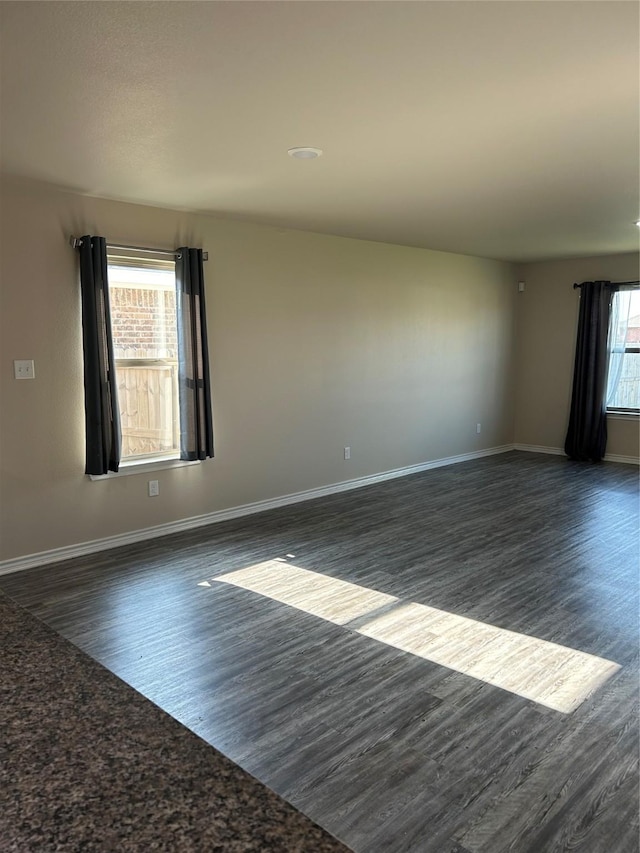18287 County Road 4001, Mabank, TX 75147 - spare room featuring dark wood finished floors and baseboards