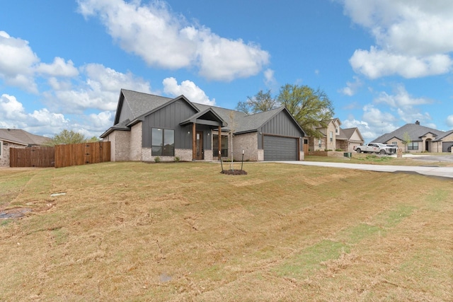 3306 Promenade Ct, Granbury, TX 76049 - view of front of house featuring board and batten siding, a garage, concrete driveway, brick siding, and roof with shingles