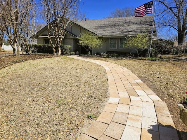 view of front of home featuring a shingled roof