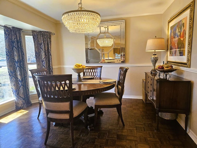 dining area featuring baseboards, an inviting chandelier, and ornamental molding