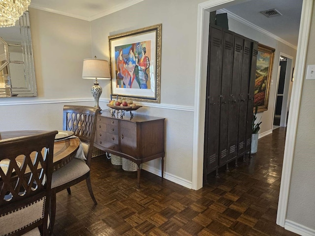 hallway with visible vents, baseboards, and ornamental molding