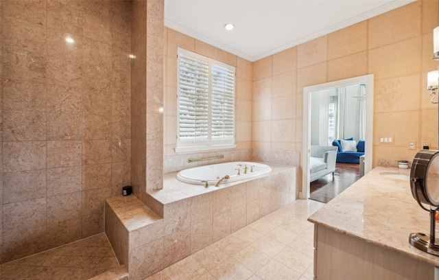 3401 Lee Pkwy Unit 3A, Dallas, TX 75219 - full bathroom with a garden tub, crown molding, vanity, tile patterned floors, and tile walls