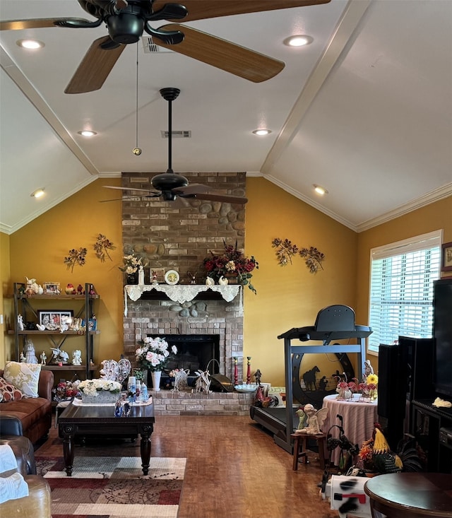 living area with ceiling fan, lofted ceiling, and visible vents