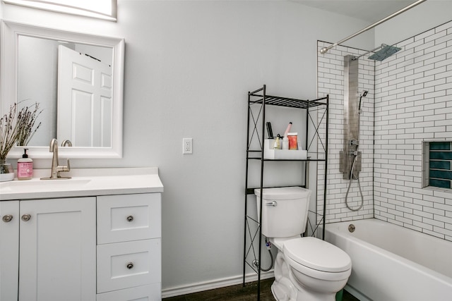full bathroom with tub / shower combination, baseboards, toilet, and vanity