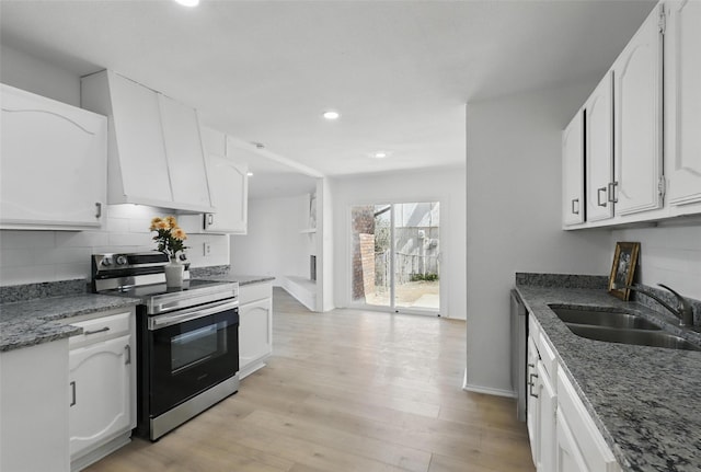1329 Steinburg Ln, Fort Worth, TX 76134 - kitchen featuring tasteful backsplash, white cabinetry, appliances with stainless steel finishes, a sink, and light wood finished floors