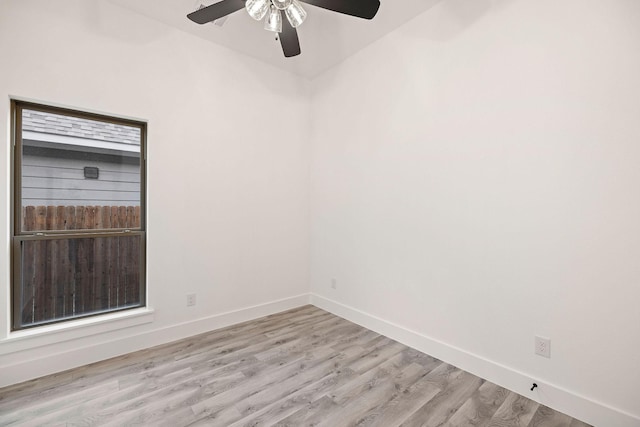 unfurnished room with light wood-style flooring, baseboards, and ceiling fan