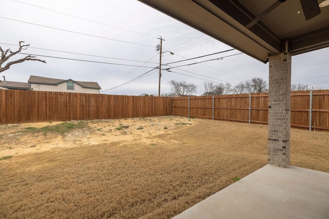 view of yard with a fenced backyard