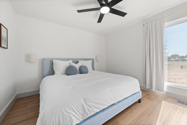 3508 Sentinel Oak Dr, Flower Mound, TX 75022 - bedroom featuring visible vents, baseboards, wood finished floors, and a ceiling fan
