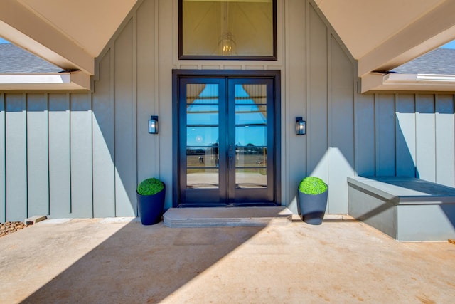 3508 Sentinel Oak Dr, Flower Mound, TX 75022 - view of exterior entry with board and batten siding, french doors, and roof with shingles