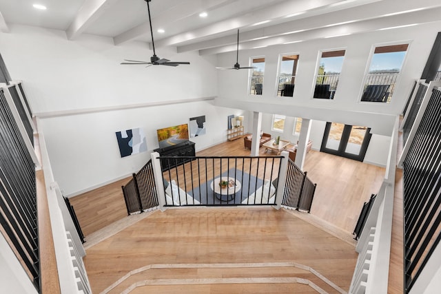 3508 Sentinel Oak Dr, Flower Mound, TX 75022 - stairs featuring beamed ceiling, recessed lighting, a ceiling fan, and wood finished floors