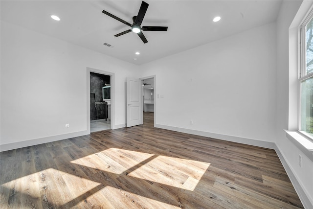 2408 Givendale Rd, Dallas, TX 75241 - unfurnished bedroom featuring wood finished floors, baseboards, ensuite bath, recessed lighting, and a ceiling fan