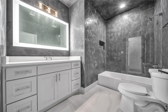 2408 Givendale Rd, Dallas, TX 75241 - full bathroom featuring toilet, marble look tile flooring, vanity, and  shower combination