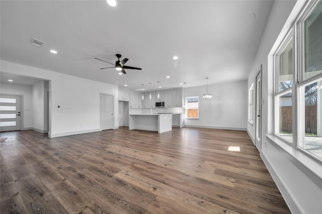 2408 Givendale Rd, Dallas, TX 75241 - unfurnished living room featuring dark wood finished floors, recessed lighting, a ceiling fan, and baseboards