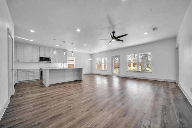 2408 Givendale Rd, Dallas, TX 75241 - unfurnished living room with a sink, recessed lighting, dark wood-style flooring, a ceiling fan, and baseboards