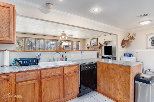 kitchen with a wealth of natural light, visible vents, dishwasher, and a sink