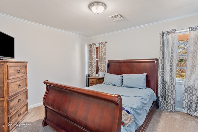 carpeted bedroom featuring baseboards, visible vents, and ornamental molding