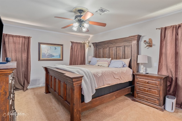 bedroom featuring ornamental molding, a ceiling fan, visible vents, and light carpet