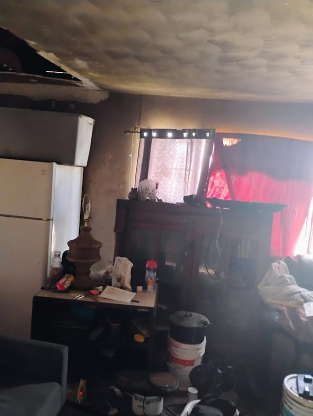 kitchen with freestanding refrigerator