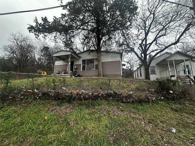 view of front of home featuring fence private yard