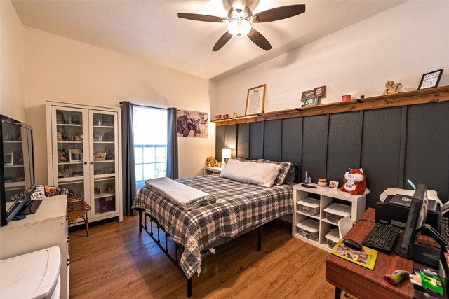 bedroom featuring ceiling fan and wood finished floors