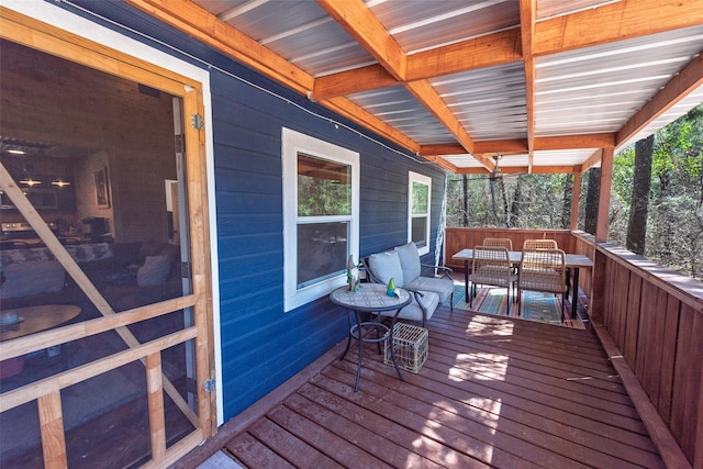wooden deck featuring outdoor dining space