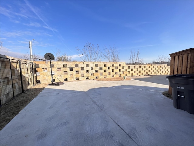 view of patio featuring fence