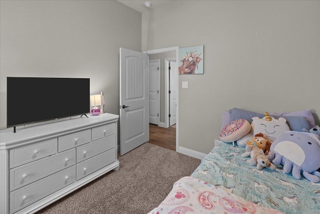 carpeted bedroom with baseboards