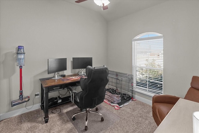 office area featuring vaulted ceiling, carpet floors, a ceiling fan, and baseboards