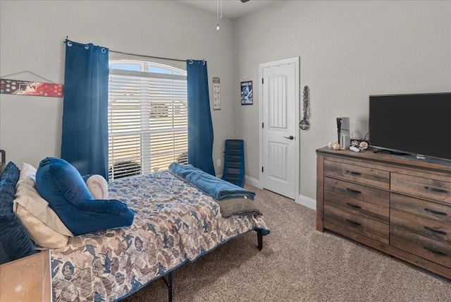 carpeted bedroom with baseboards