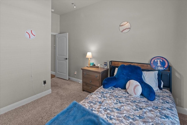 bedroom featuring baseboards and carpet flooring