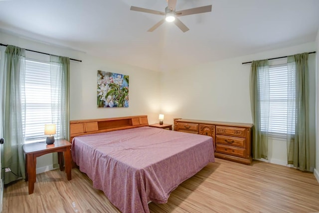 bedroom featuring light wood-type flooring and a ceiling fan