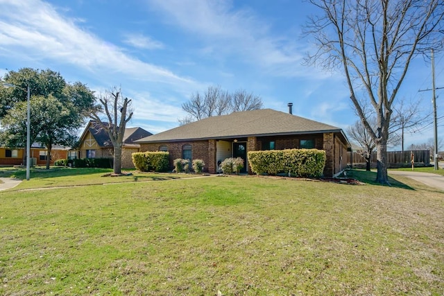 ranch-style house with brick siding, a front lawn, and fence