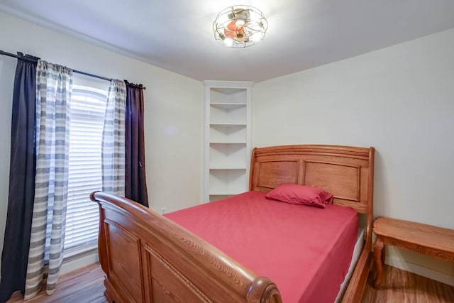 bedroom featuring wood finished floors