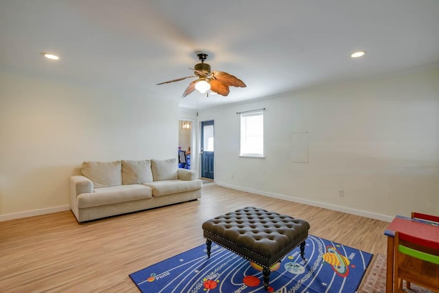 living room featuring recessed lighting, baseboards, wood finished floors, and a ceiling fan