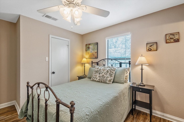 736 Wildwood Trl, Holly Lake Ranch, TX 75765 - bedroom featuring wood finished floors, baseboards, and a ceiling fan
