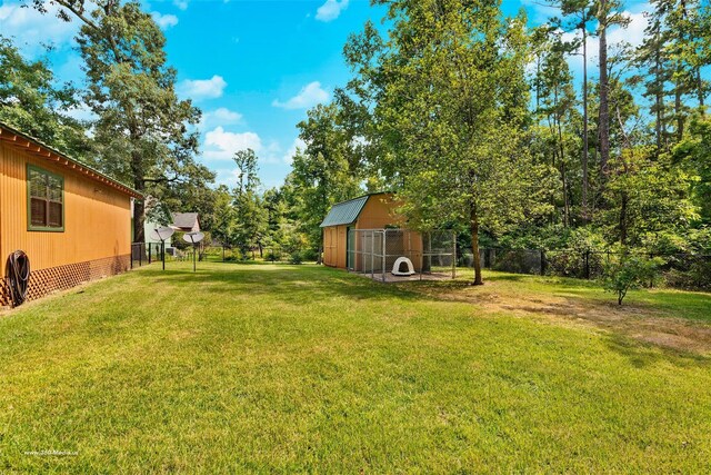 736 Wildwood Trl, Holly Lake Ranch, TX 75765 - view of yard with an outbuilding