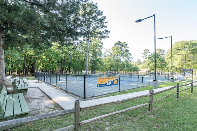 736 Wildwood Trl, Holly Lake Ranch, TX 75765 - view of tennis court featuring view of scattered trees