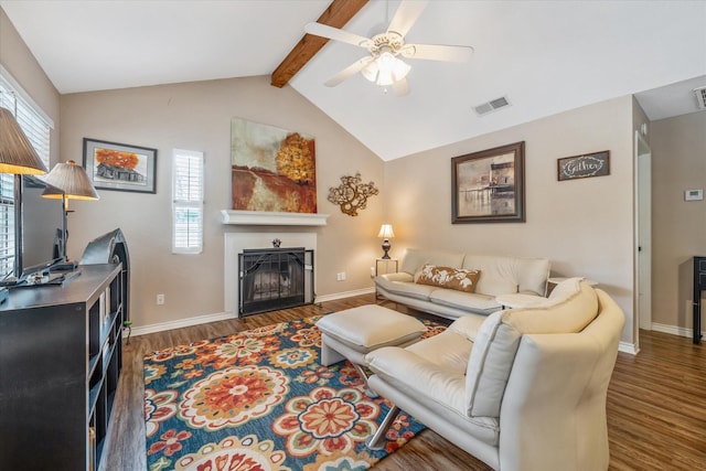 736 Wildwood Trl, Holly Lake Ranch, TX 75765 - living room featuring wood finished floors, healthy amount of natural light, a ceiling fan, and a fireplace