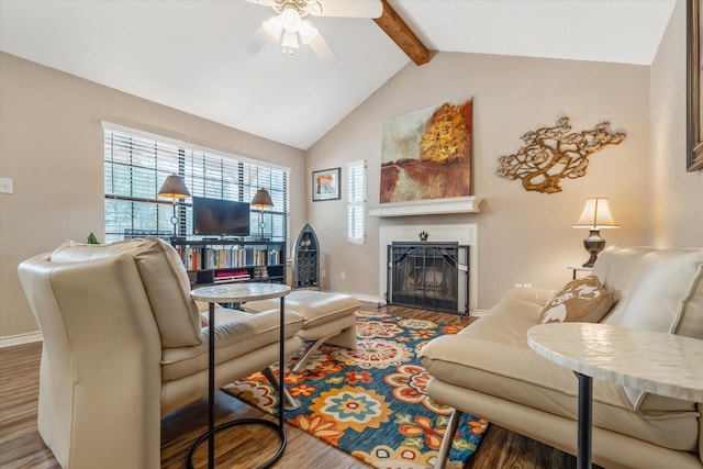 736 Wildwood Trl, Holly Lake Ranch, TX 75765 - living area with wood finished floors, ceiling fan, beam ceiling, baseboards, and high vaulted ceiling