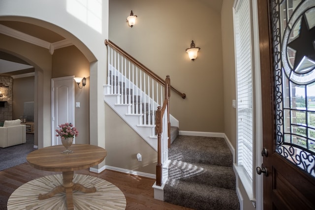 12530 Fm 2932, Forney, TX 75126 - foyer entrance with arched walkways, crown molding, baseboards, and stairs
