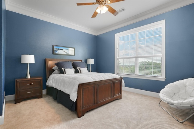 bedroom with visible vents, ornamental molding, a ceiling fan, baseboards, and light colored carpet