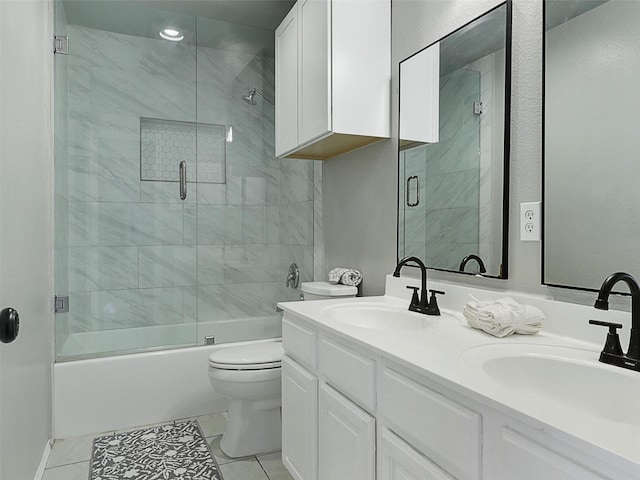 2905 Cabot Ln, Mckinney, TX 75072 - bathroom with toilet, tile patterned flooring, double vanity, and bath / shower combo with glass door