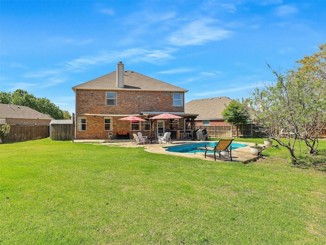 2905 Cabot Ln, Mckinney, TX 75072 - rear view of property with a chimney, a patio, and brick siding