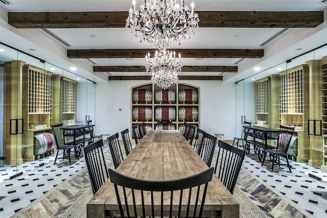 dining room featuring a notable chandelier, visible vents, and beam ceiling