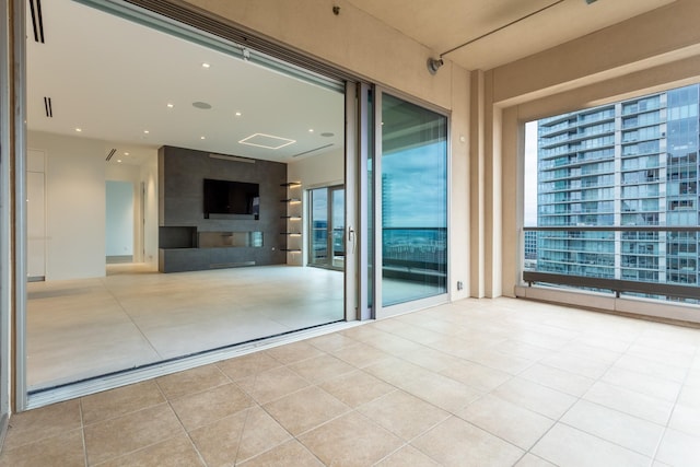 2300 Wolf St Unit 15C, Dallas, TX 75201 - unfurnished room with tile patterned floors, visible vents, a healthy amount of sunlight, and recessed lighting