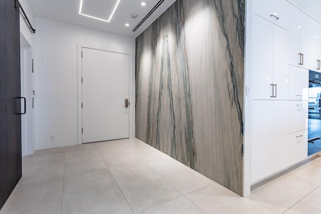 2300 Wolf St Unit 15C, Dallas, TX 75201 - hallway with light tile patterned floors