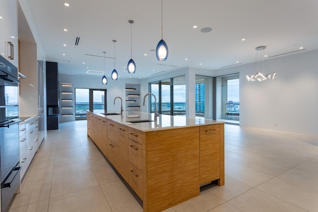 2300 Wolf St Unit 15C, Dallas, TX 75201 - kitchen with a sink, a spacious island, modern cabinets, and open floor plan