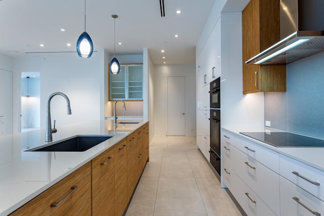 2300 Wolf St Unit 15C, Dallas, TX 75201 - kitchen featuring brown cabinetry, black appliances, wall chimney exhaust hood, and a sink