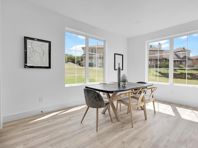 310 Harborview Dr, Rockwall, TX 75032 - dining room with light wood-style flooring and baseboards